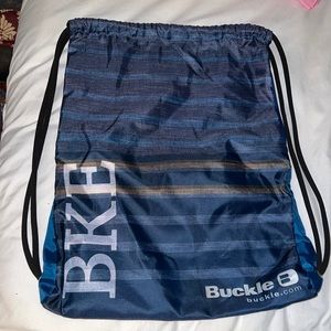 Buckle drawstring bag